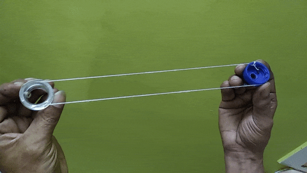 bottle caps coupled using nylon thread